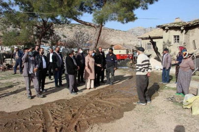 MHP HEYETİ’NDEN YANGINZEDE AİLEYE ZİYARET